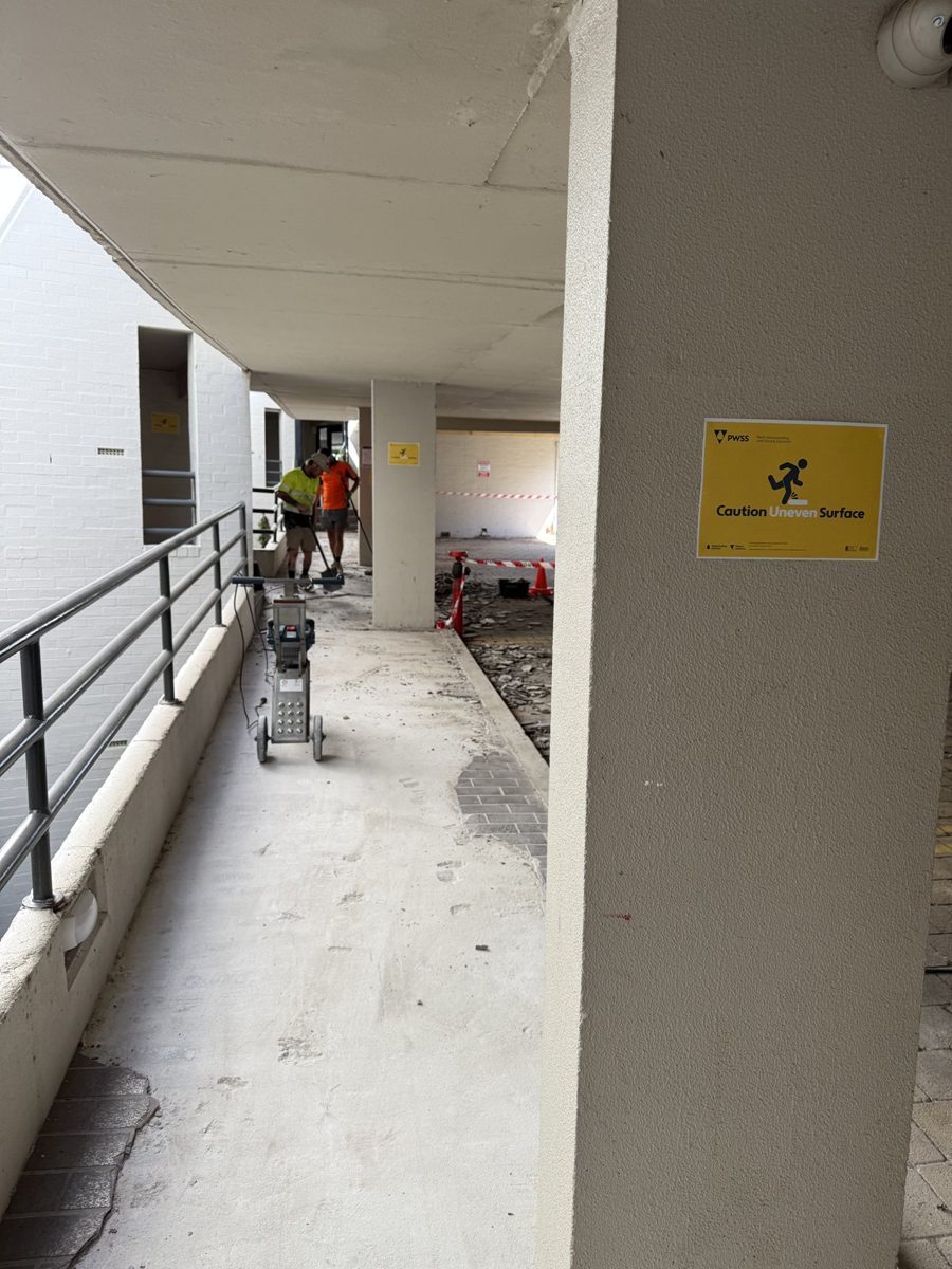 PWSS team grinding substrate during walkway demolition at 2 Goderich Street East Perth