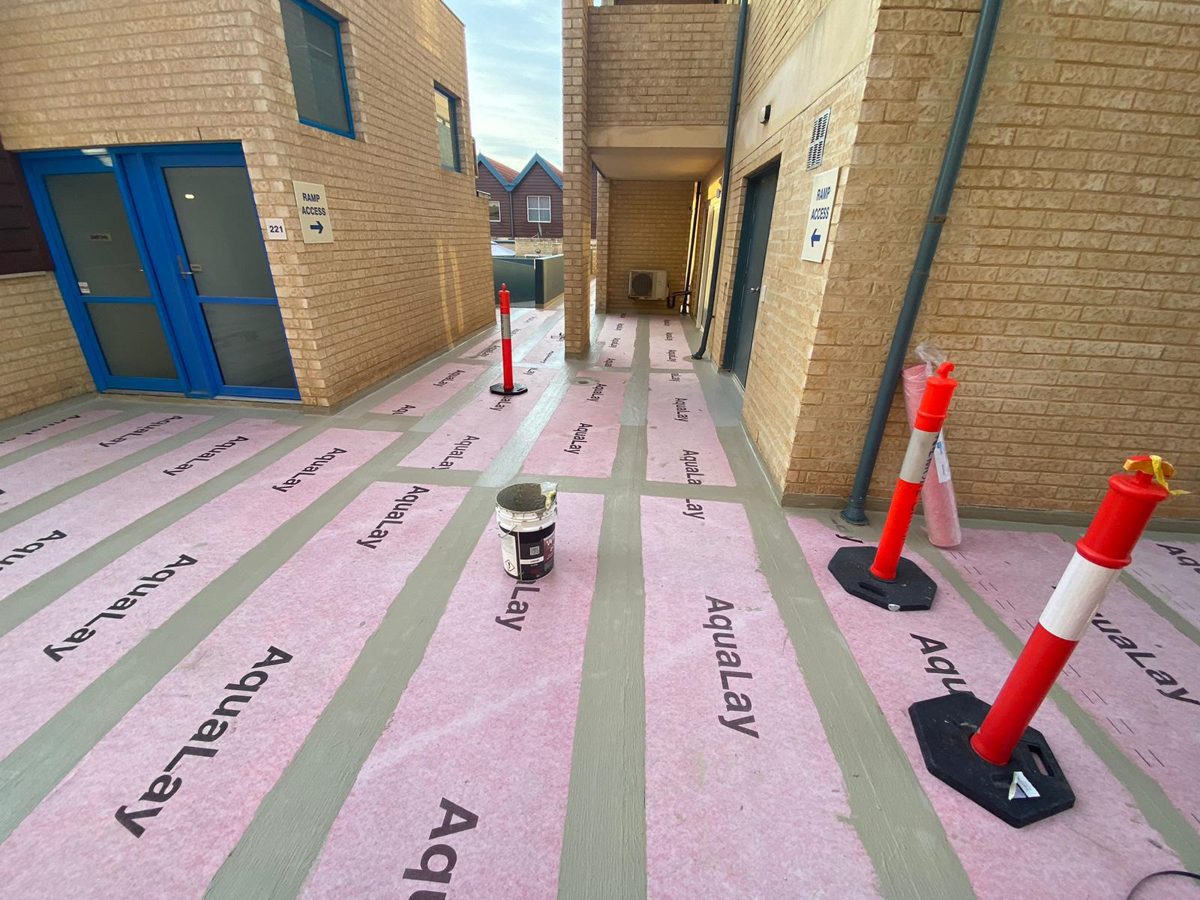 WPA Aqualay waterproofing membrane installation across 1000m² of walkways in Hillarys